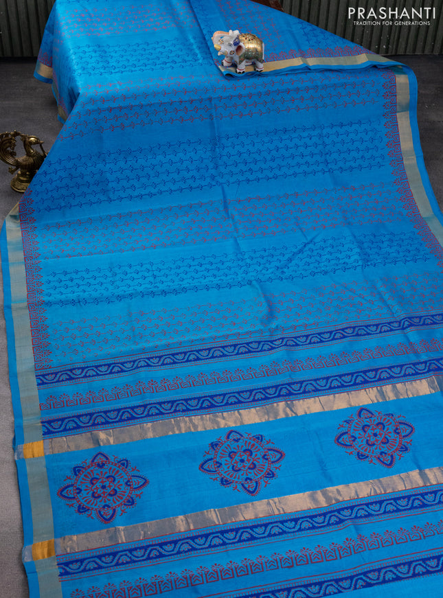 Silk cotton block printed saree cs blue with allover prints and zari woven border