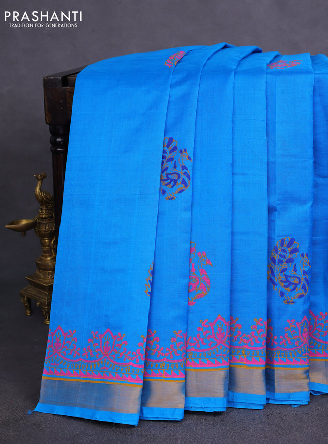 Silk cotton block printed saree cs blue with allover prints and zari woven border