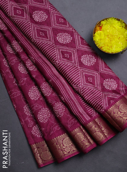 Semi dola saree wine shade with floral prints & self emboss and zari woven border