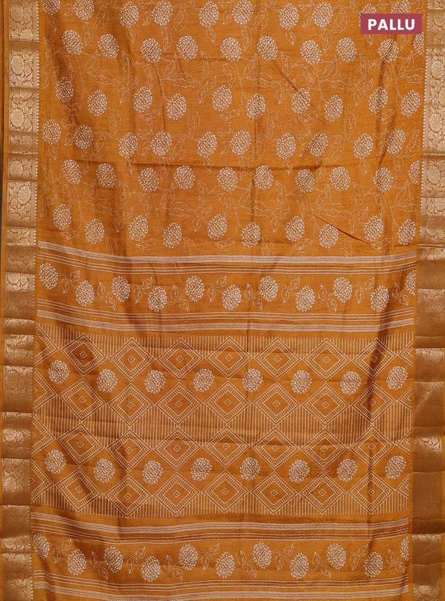 Semi dola saree mustard yellow with floral prints & self emboss and zari woven border