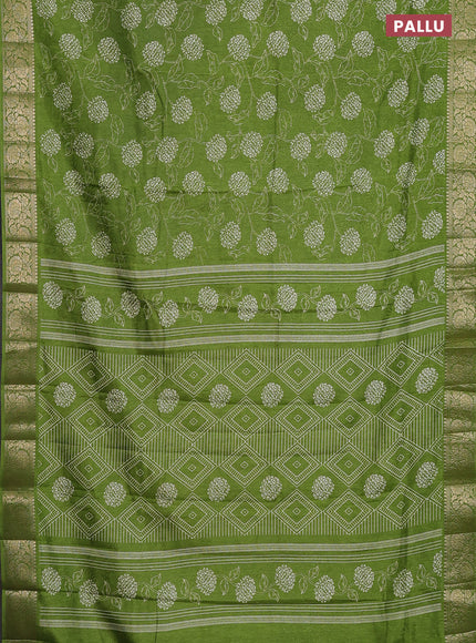 Semi dola saree mehendi green with floral prints & self emboss and zari woven border