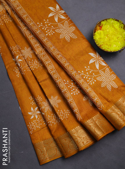 Semi dola saree mustard yellow with floral prints & self emboss and zari woven border