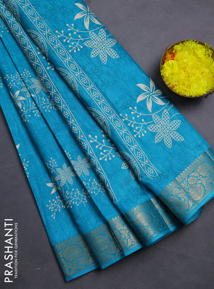 Semi dola saree teal blue with floral prints & self emboss and zari woven border