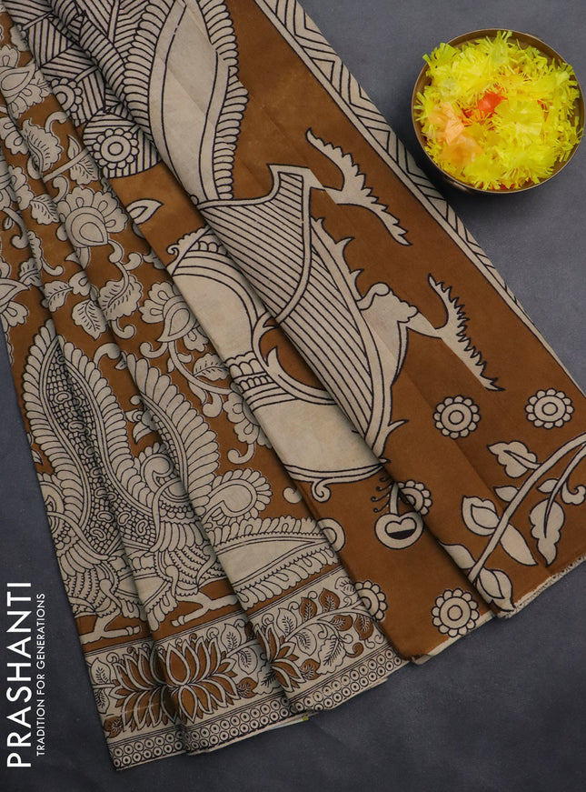 Kalamkari cotton saree dark mustard and beige with allover prints and printed border