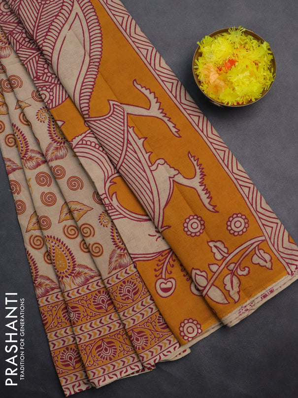 Kalamkari cotton saree beige and orange with allover prints and printed border