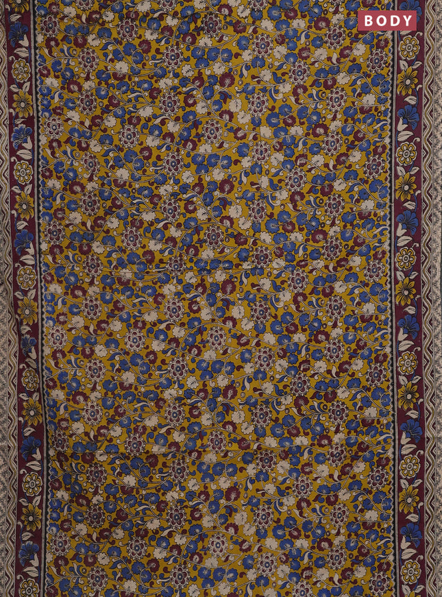 Kalamkari cotton saree yellow and wine shade with allover prints and printed border