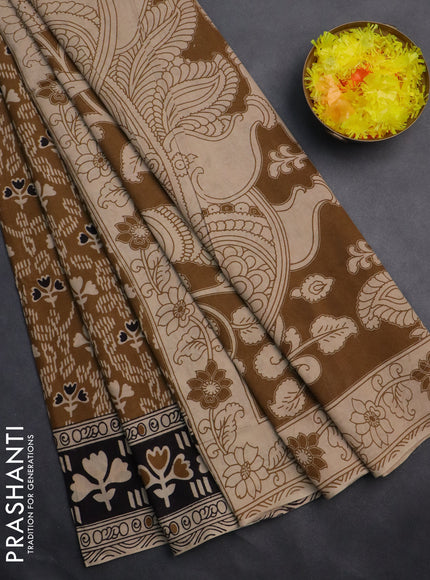 Kalamkari cotton saree dark mustard and black with allover prints and printed border