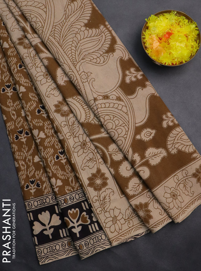 Kalamkari cotton saree dark mustard and black with allover prints and printed border