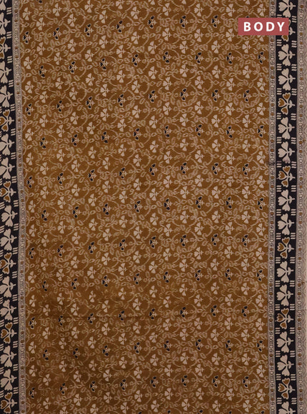 Kalamkari cotton saree dark mustard and black with allover prints and printed border