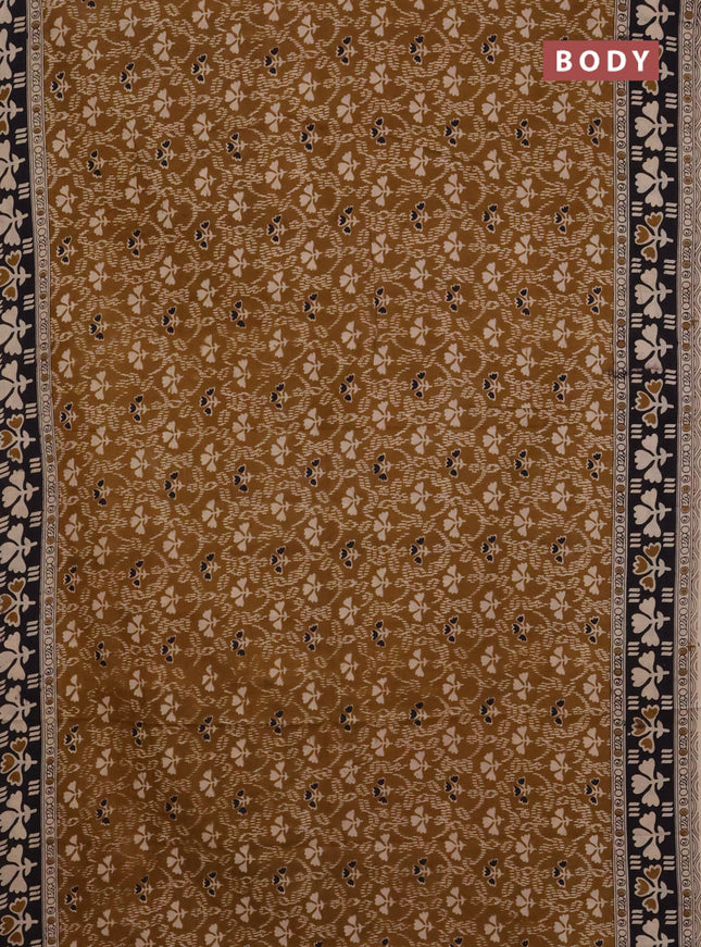 Kalamkari cotton saree dark mustard and black with allover prints and printed border