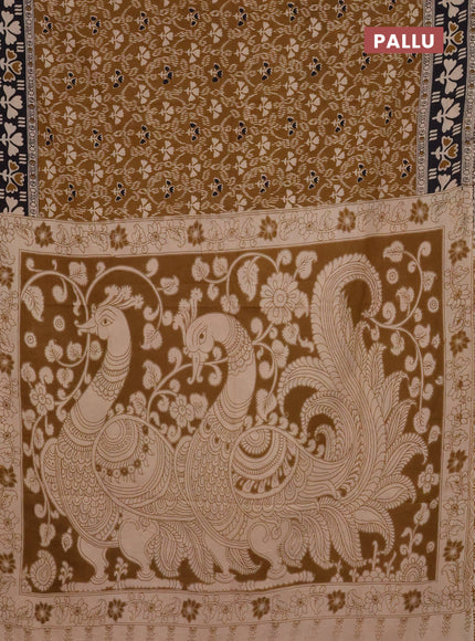 Kalamkari cotton saree dark mustard and black with allover prints and printed border