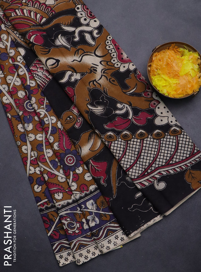 Kalamkari cotton saree dark mustard and blue shade with allover prints and printed border