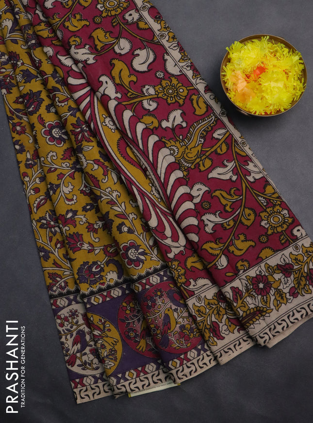 Kalamkari cotton saree yellow and violet with allover prints and printed border