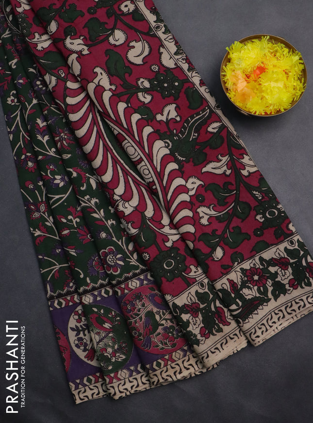 Kalamkari cotton saree dark green and violet with allover prints and printed border