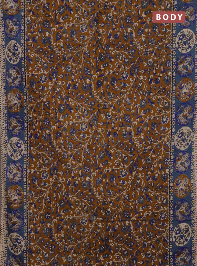 Kalamkari cotton saree dark mustard and greyish blue with allover prints and printed border