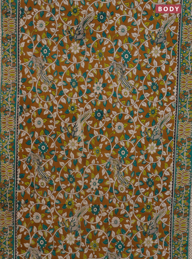 Kalamkari cotton saree mustard yellow and green with allover prints and printed border