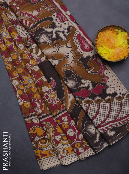 Kalamkari cotton saree dark mustard and dark pink with allover prints and printed border