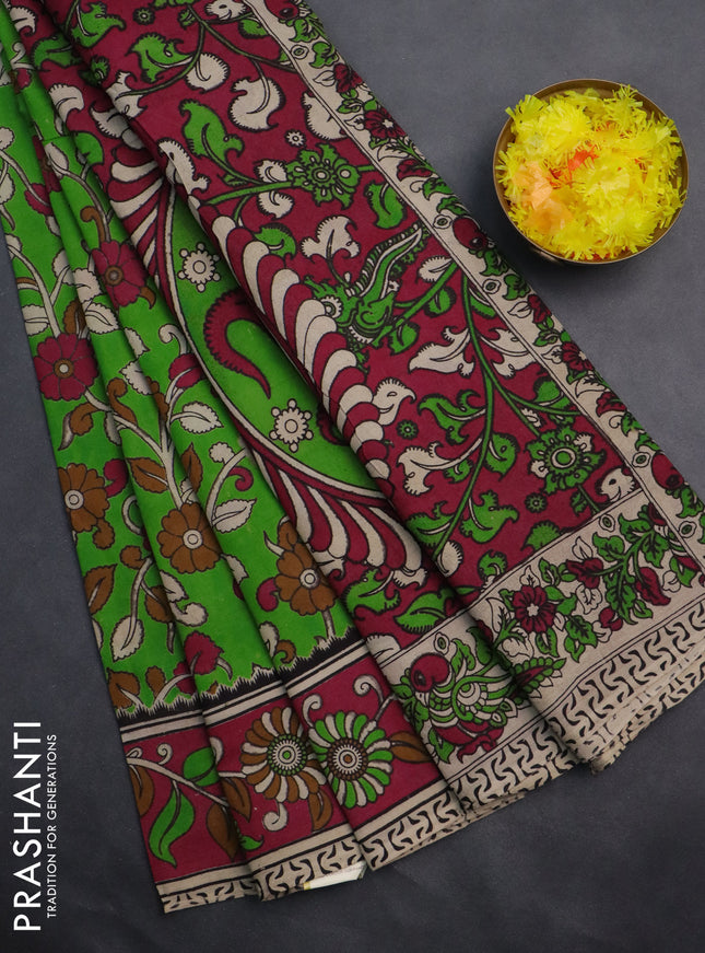Kalamkari cotton saree light green and pink with allover prints and printed border
