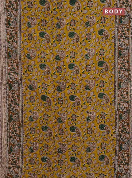 Kalamkari cotton saree yellow and dark mustard with allover prints and printed border
