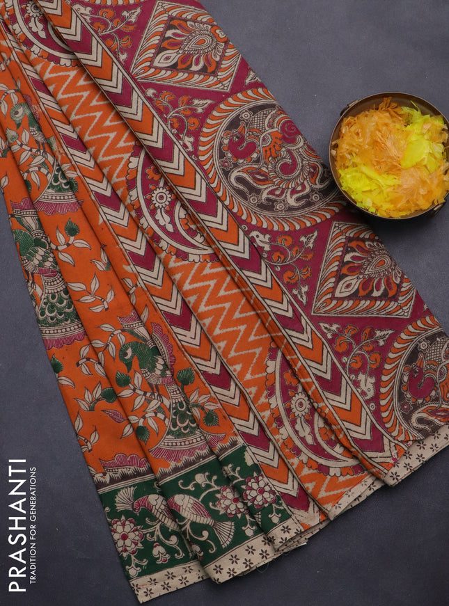 Kalamkari cotton saree orange and green with allover prints and printed border