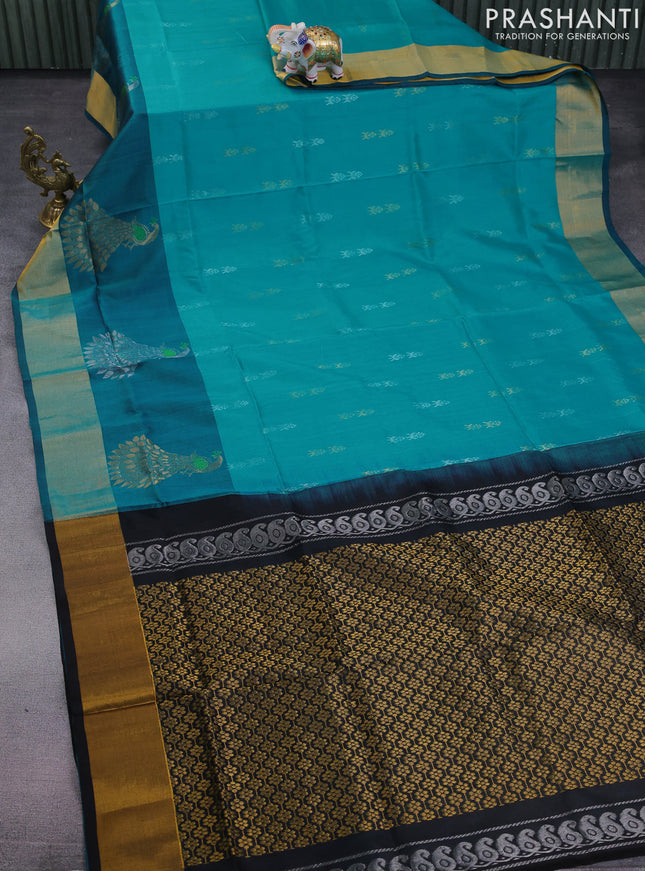 Pure uppada silk saree teal blue and black with allover silver & gold zari woven buttas and long zari woven peacock butta border