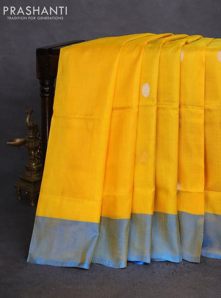 Pure uppada silk saree yellow and cs blue with silver & gold zari woven coin buttas and simple border