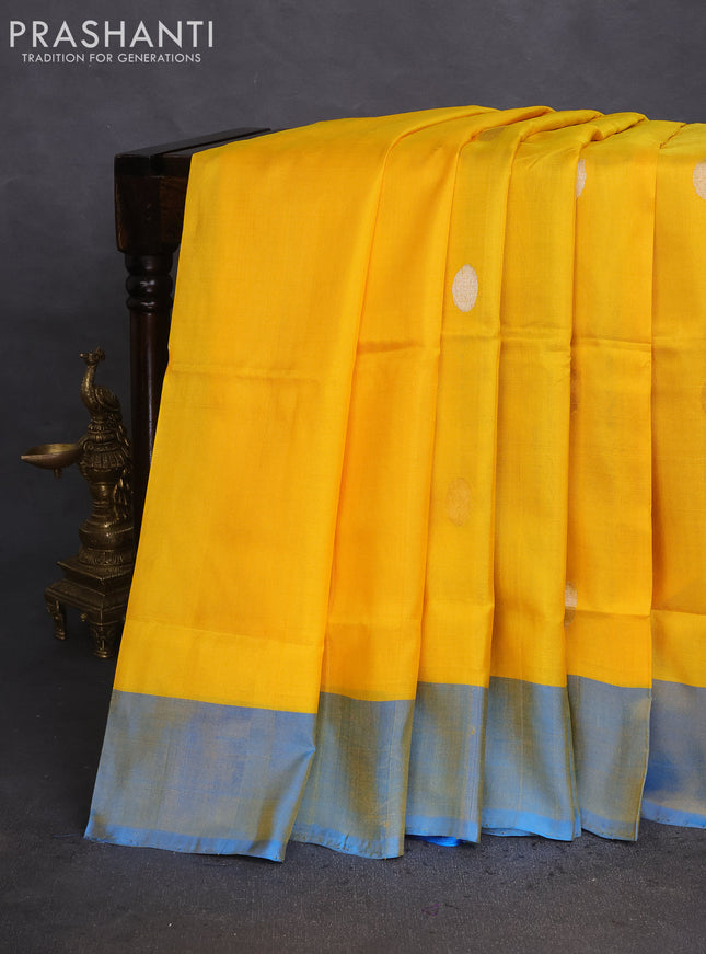 Pure uppada silk saree yellow and cs blue with silver & gold zari woven coin buttas and simple border