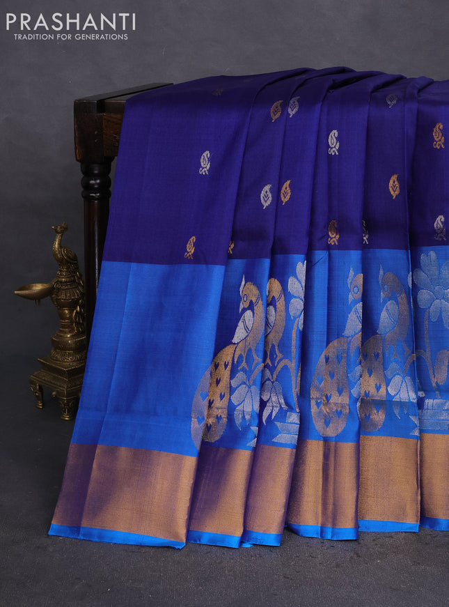 Pure uppada silk saree dark blue and cs blue with allover silver & gold zari weaves and long peacock design zari woven border