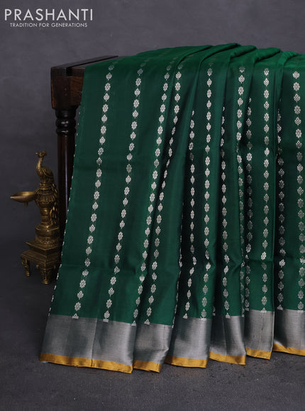 Pure uppada silk saree dark green and yellow with allover silver zari woven butta weaves and silver zari woven border
