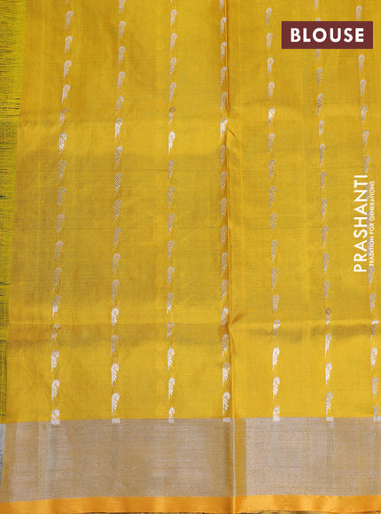 Pure uppada silk saree dark green and yellow with allover silver zari woven butta weaves and silver zari woven border