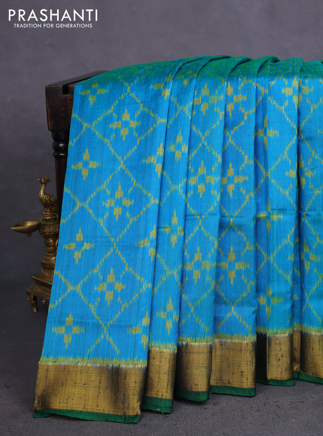 Rajkot patola silk saree cs blue and green with allover ikat weaves & jute finish and zari woven border