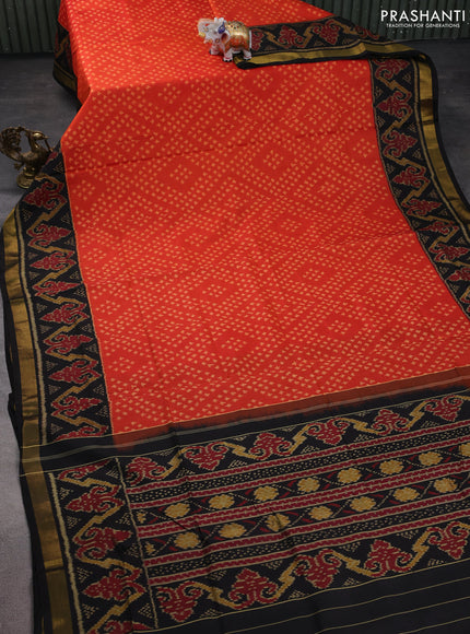 Rajkot patola silk saree orange and black with allover ikat weaves and zari woven border