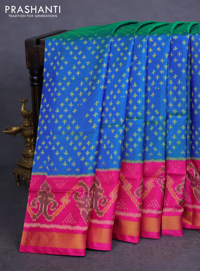 Rajkot patola silk saree dual shade of teal blue and magenta pink with allover ikat weaves and zari woven border