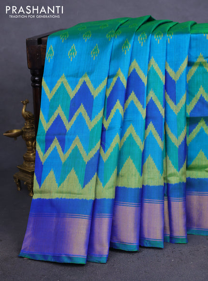 Rajkot patola silk saree dual shade teal bluish green with allover ikat weaves and zari woven border