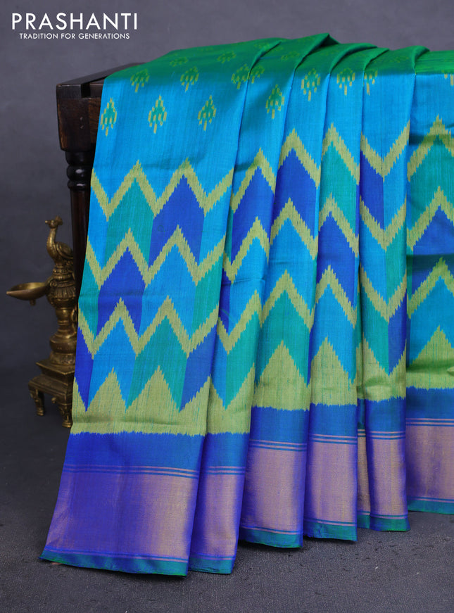 Rajkot patola silk saree dual shade teal bluish green with allover ikat weaves and zari woven border