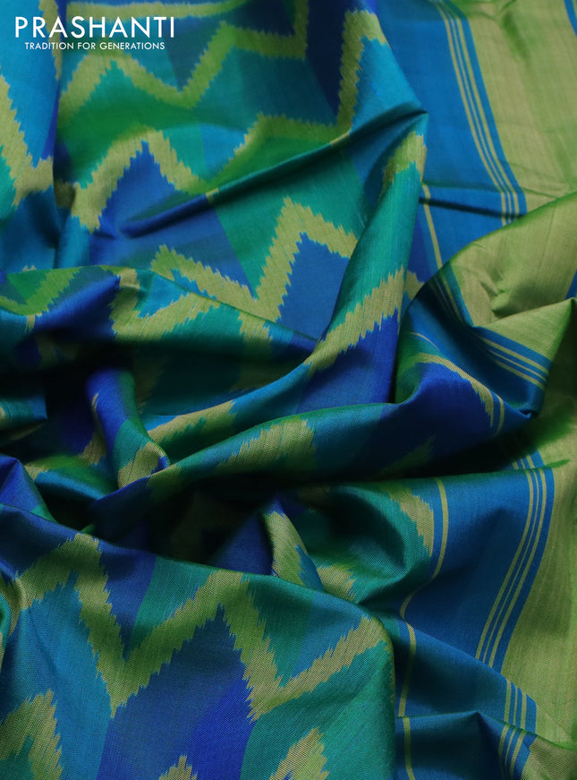 Rajkot patola silk saree dual shade teal bluish green with allover ikat weaves and zari woven border