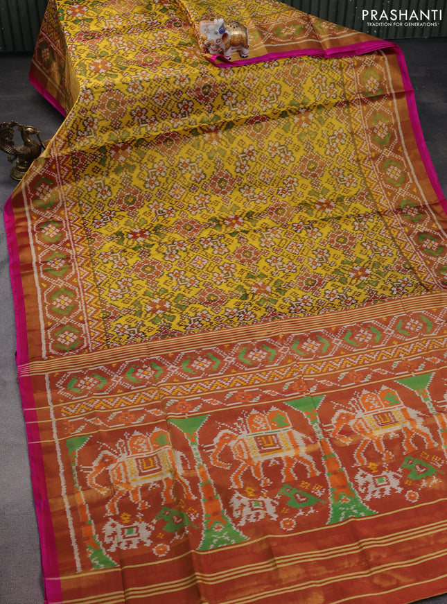 Rajkot patola ttissue silk saree yellow and gold with allover ikat weaves and zari woven border