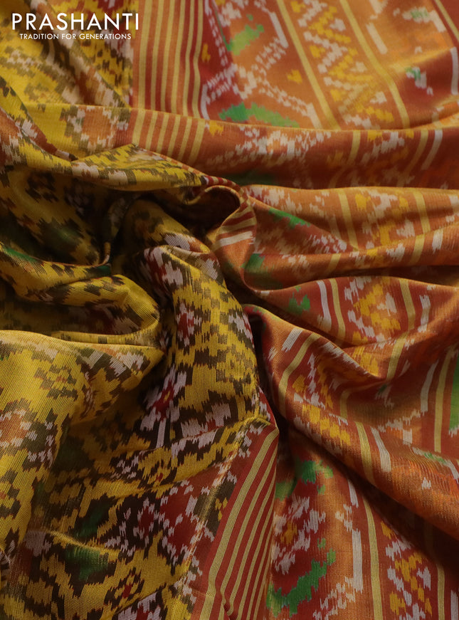Rajkot patola ttissue silk saree yellow and gold with allover ikat weaves and zari woven border