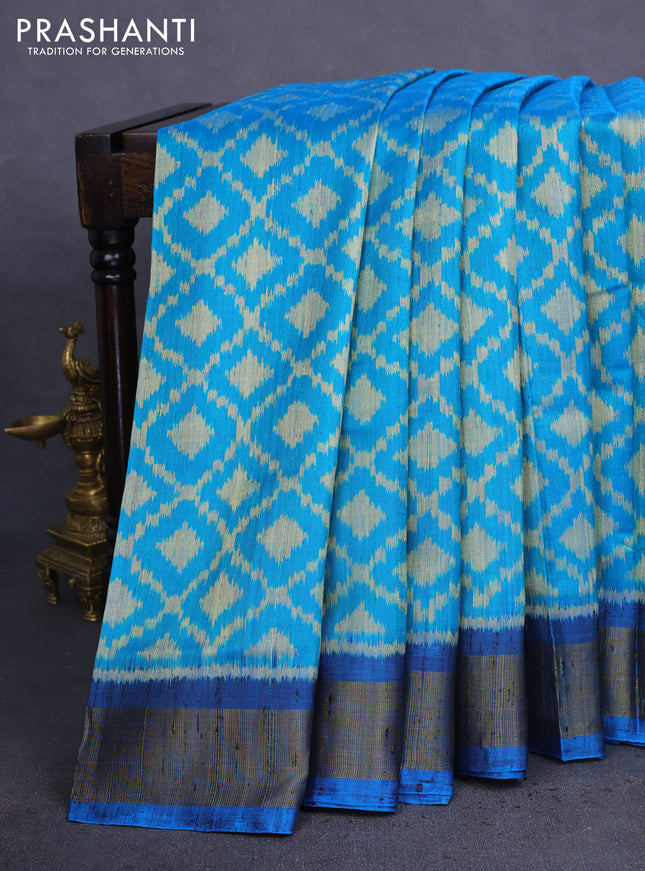 Rajkot patola silk saree teal blue and cs blue with allover ikat weaves & jute finish and zari woven border