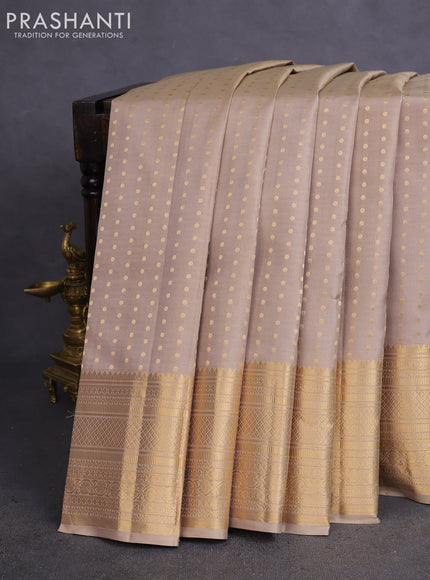 Pure kanchipuram silk saree beige and pink with allover zari woven 1000 buttas and zari woven border