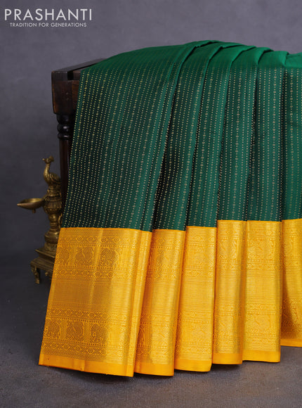 Pure kanchipuram silk saree bottle green and mustard yellow with allover zari woven 1000 butta weaves and long zari woven korvai border