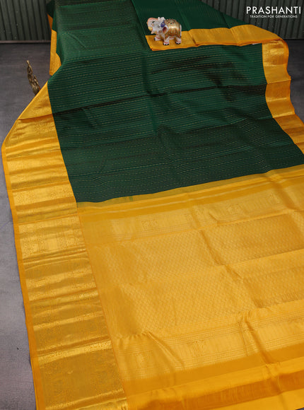 Pure kanchipuram silk saree bottle green and mustard yellow with allover zari woven 1000 butta weaves and long zari woven korvai border