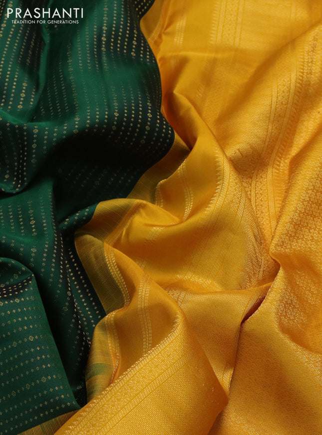 Pure kanchipuram silk saree bottle green and mustard yellow with allover zari woven 1000 butta weaves and long zari woven korvai border