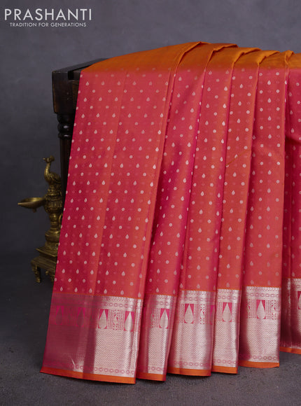 Pure kanchipuram silk saree dual shade of pinksh orange and teal blue with allover silver zari woven 1000 butta weaves and rich zari woven border