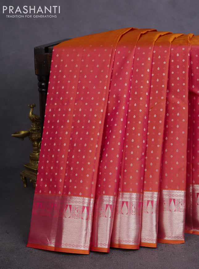 Pure kanchipuram silk saree dual shade of pinksh orange and teal blue with allover silver zari woven 1000 butta weaves and rich zari woven border