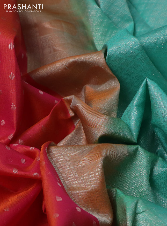 Pure kanchipuram silk saree dual shade of pinksh orange and teal blue with allover silver zari woven 1000 butta weaves and rich zari woven border