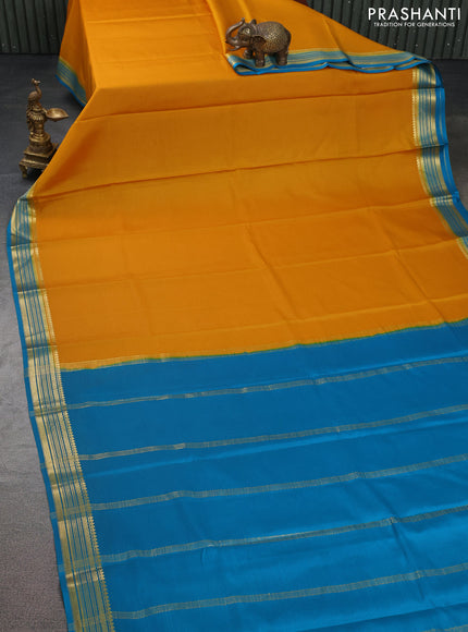 Pure mysore silk saree mango yellow and cs blue with plain body and zari woven border
