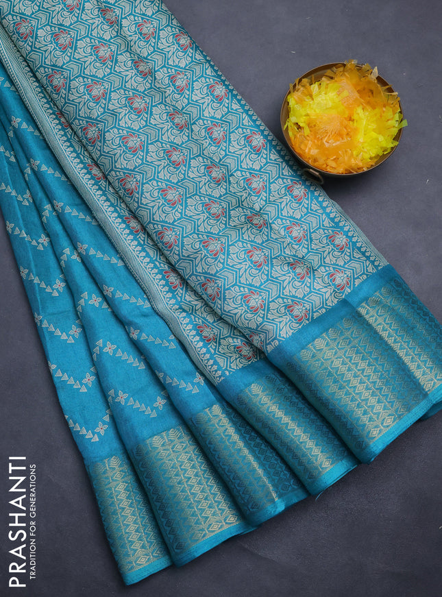 Semi dola saree teal blue with allover zig zag prints and zari woven border