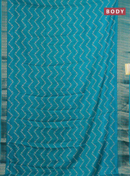 Semi dola saree teal blue with allover zig zag prints and zari woven border