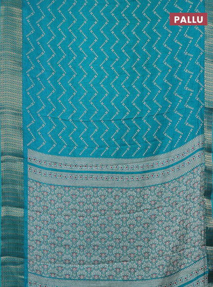 Semi dola saree teal blue with allover zig zag prints and zari woven border